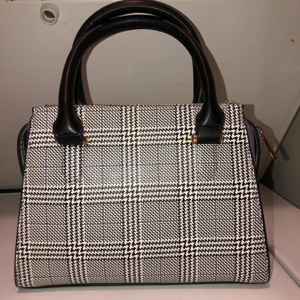 Cute purse with purple detail.